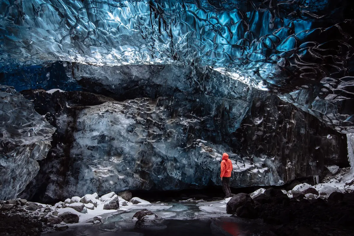 An ice cave in Vatnajökull with a person for scale