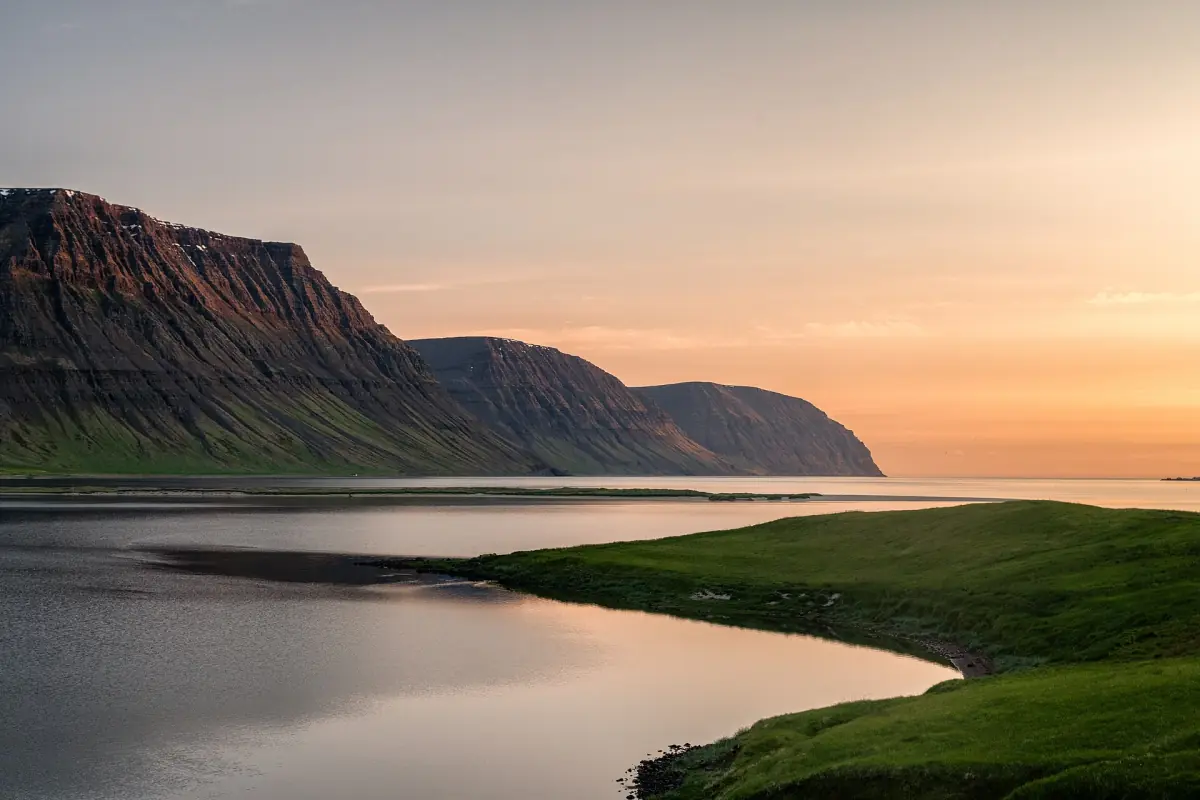 A curving coast in the light of the midnight sun