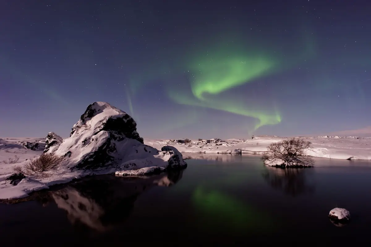 Northern lights over a frozen lake in Iceland